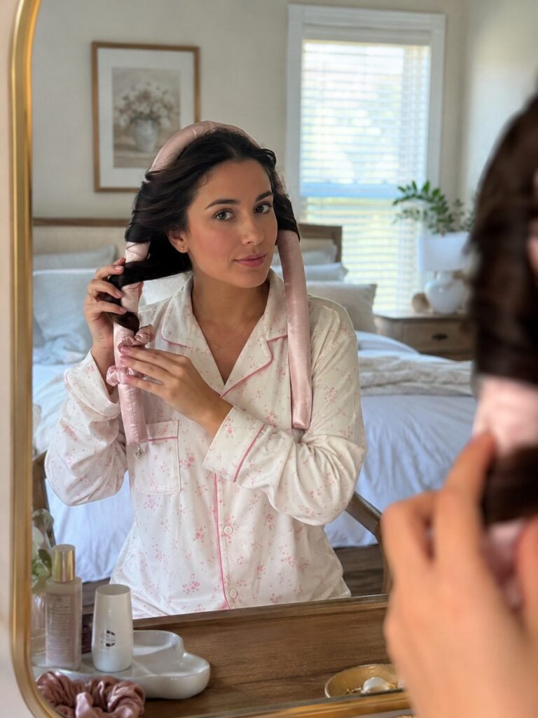 Woman wrapping hair around a satin heatless curler